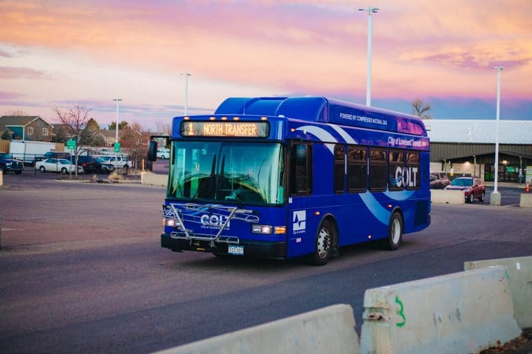Evening scene with blue transit bus