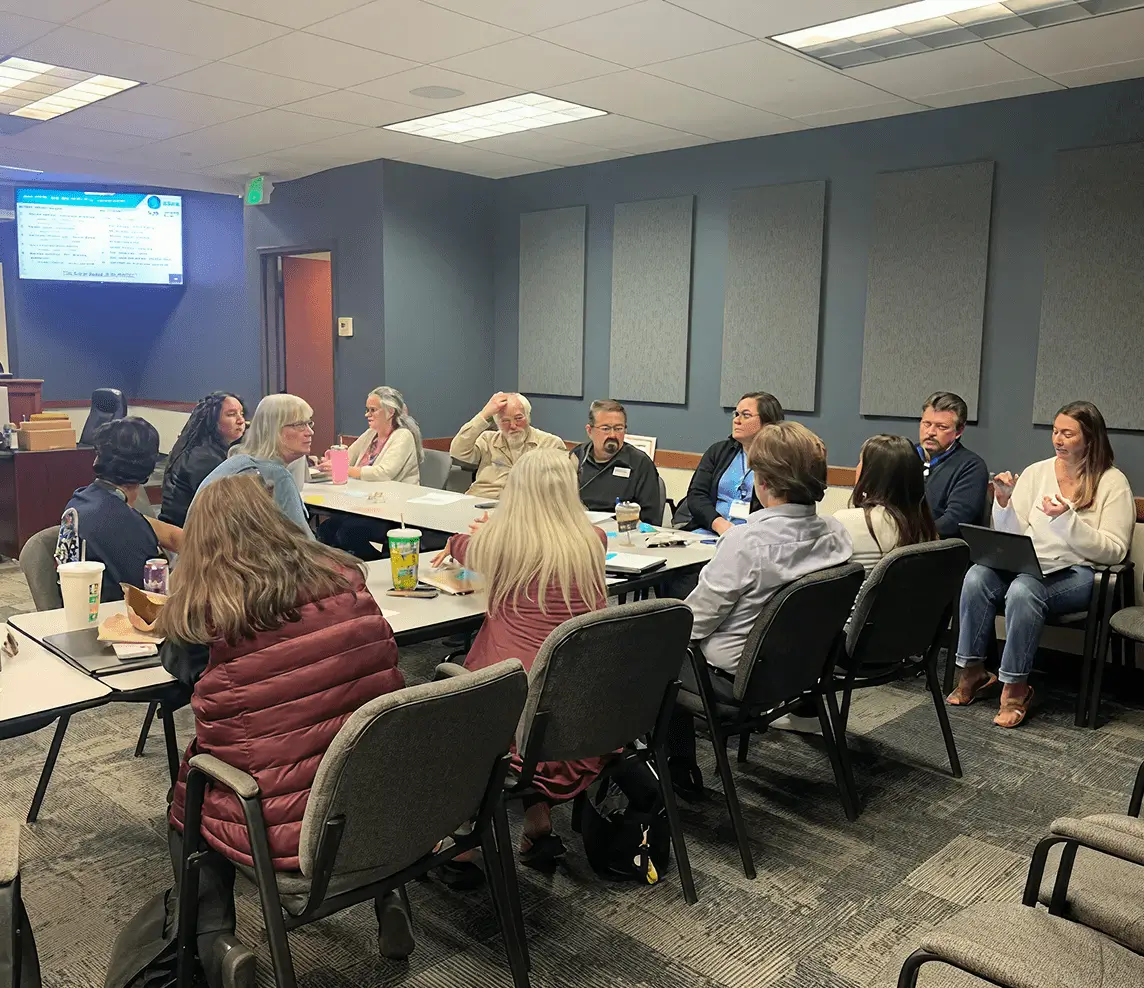 A group meeting around conference table